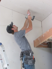 Screwing in sheetrock to the ceiling