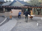 Placing plywood to protect the concrete sidewalks