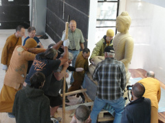 Levering the 3,000 lb Buddha into place
