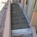 Preparing concrete pour for sidewalk outside the kitchen