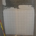 Shower tile work continues