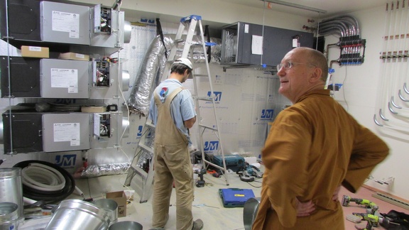 Ajahn Pasanno inspects the mechanical room