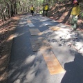 Laying out plywood to protect our road from bulldozer treads