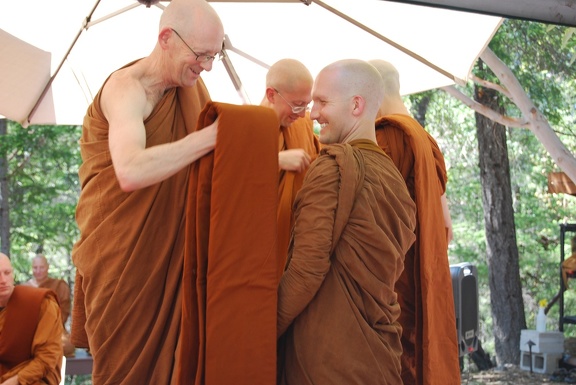 Tan Kondañño and Tan Jāgaro help the Sāmaṇeras with arranging their newly sewn robes
