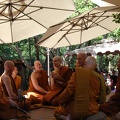 Sāmaṇeras Guṇavīro and Tissaro sit amidst the Sangha