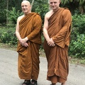 Luang Por Pasanno and Ajahn Jayasaro outside of Luang Por's cave retreat in Thailand