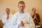 A new monastic postulant gives a blessing before the meal