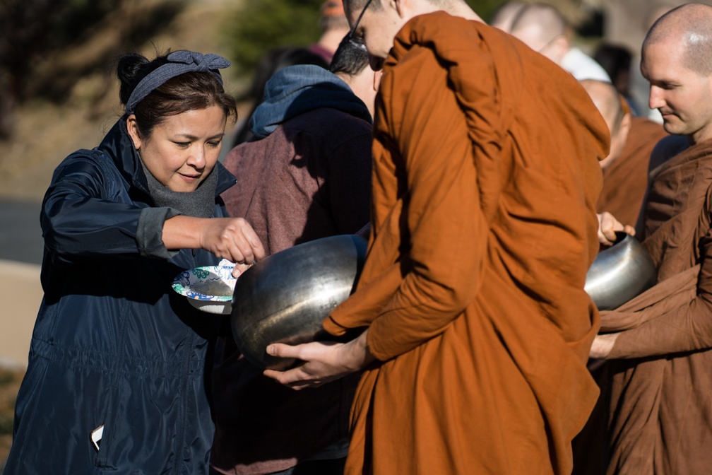 Offering alms to the monks