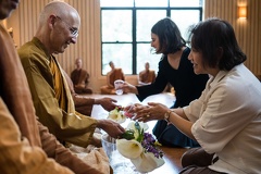 Senior monks receive lay guests.