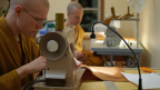 Tan Gambhīro and Tan Pesalo are up first sewing the Kathina robe