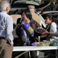 Volunteers help to organize food offerings