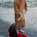 Ajahn Kassapo stirring the dye bath