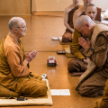 Newly-ordained monk Tan Dhammavaro bows to Luang Por Pasanno, his Preceptor.