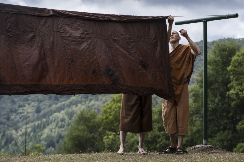 In a process developed at the time of the Buddha, a robe will be flipped in three steps so the natural dye settles evenly on the cloth. This rotation also prevents "racing stripes" as dye drips down the sides.