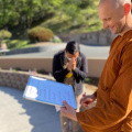 Ajahn Ñaniko with a supporter